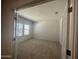 Bright bedroom features neutral carpet and lots of natural light at 24627 W Ripple Rd, Buckeye, AZ 85326