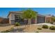 Charming home featuring desert landscaping, a well manicured yard and a two-car garage at 24627 W Ripple Rd, Buckeye, AZ 85326