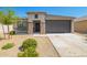 Charming single-story home with desert landscaping and a two-car garage at 24627 W Ripple Rd, Buckeye, AZ 85326
