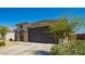 Attractive single-story home with a low-maintenance front yard and a two-car garage at 24627 W Ripple Rd, Buckeye, AZ 85326