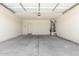 This garage features a door to the outside and a water heater at 24627 W Ripple Rd, Buckeye, AZ 85326