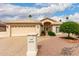 Charming beige home with a two-car garage, desert landscaping, a tile roof, and mature trees at 24907 S Lakestar Dr, Sun Lakes, AZ 85248
