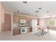An airy kitchen with white appliances and laminate countertops at 24907 S Lakestar Dr, Sun Lakes, AZ 85248
