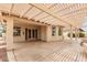 Covered patio with textured concrete flooring and view of backyard landscaping at 24907 S Lakestar Dr, Sun Lakes, AZ 85248