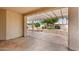 Covered patio with textured concrete flooring and view of backyard trees at 24907 S Lakestar Dr, Sun Lakes, AZ 85248