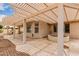 Covered patio featuring a built-in round planter, offering a relaxing outdoor space at 24907 S Lakestar Dr, Sun Lakes, AZ 85248