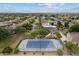 Aerial view of a full tennis and basketball court in a neighborhood surrounded by lush trees at 2625 N 24Th St # 22, Mesa, AZ 85213