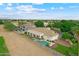 Expansive backyard features a pool, spa, covered patio, and well maintained desert landscaping at 2625 N 24Th St # 22, Mesa, AZ 85213
