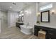 Spa-like bathroom with a freestanding tub, dual vanities, and modern fixtures at 2625 N 24Th St # 22, Mesa, AZ 85213