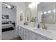 Double vanity bathroom featuring elegant mirrors, modern fixtures, and a bright, open layout at 2625 N 24Th St # 22, Mesa, AZ 85213