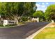 Estates at Northridge gated community entrance featuring lush trees and shrubs at 2625 N 24Th St # 22, Mesa, AZ 85213