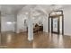Welcoming entryway with arched openings, dining area, and decorative wrought iron front door at 2625 N 24Th St # 22, Mesa, AZ 85213