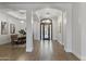Elegant entryway with arched openings, wood flooring, and decorative glass front door at 2625 N 24Th St # 22, Mesa, AZ 85213