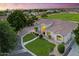 Stunning single-story home with a circular drive, lush landscaping, and a meticulously maintained front yard at 2625 N 24Th St # 22, Mesa, AZ 85213