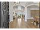 Elegant foyer showcases beautiful hardwood floors, arched entryways, and a glimpse into the bright living spaces at 2625 N 24Th St # 22, Mesa, AZ 85213