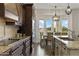 Gourmet kitchen with granite countertops, stainless appliances, and a view of the outdoor dining area at 2625 N 24Th St # 22, Mesa, AZ 85213