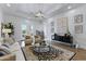 Bright and airy living room with hardwood floors, stylish decor, and access to the outdoors at 2625 N 24Th St # 22, Mesa, AZ 85213