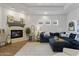 Inviting living room featuring a stone fireplace, comfortable blue sectional sofa, and stylish decor at 2625 N 24Th St # 22, Mesa, AZ 85213