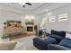 Comfortable living room features a stone fireplace, ceiling fan, and modern decor at 2625 N 24Th St # 22, Mesa, AZ 85213