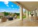 Spacious covered patio features comfortable seating and an outdoor kitchen for entertaining guests at 2625 N 24Th St # 22, Mesa, AZ 85213
