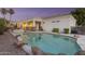 Sparkling pool and spa with rock features, enclosed by a safety fence, offering a private backyard retreat at 2625 N 24Th St # 22, Mesa, AZ 85213