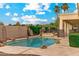 Beautiful pool with rock features and spa provides a resort-like experience in the backyard at 2625 N 24Th St # 22, Mesa, AZ 85213
