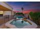 An in-ground swimming pool and hot tub are surrounded by desert landscaping and a privacy fence at 2625 N 24Th St # 22, Mesa, AZ 85213