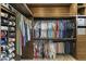 Large walk-in closet with custom wood storage solutions for shoes, clothes, and accessories at 2625 N 24Th St # 22, Mesa, AZ 85213