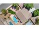 Aerial view of backyard featuring a large pool with a rock surround and a grassy area at 2648 E Teakwood Pl, Chandler, AZ 85249