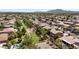 Scenic aerial view showcasing community featuring landscaped greenery and mountain views at 2648 E Teakwood Pl, Chandler, AZ 85249