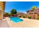 Landscaped backyard featuring a private pool and mature trees, perfect for outdoor living and relaxation at 2648 E Teakwood Pl, Chandler, AZ 85249