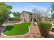 Large backyard features manicured lawn, mature trees, and gravel landscaping at 2648 E Teakwood Pl, Chandler, AZ 85249
