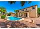 Inviting backyard featuring a pool, lush landscaping, and a neutral-colored home at 2648 E Teakwood Pl, Chandler, AZ 85249