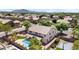 Aerial view of backyard featuring a pool, artificial turf, privacy fence, and basketball court at 2648 E Teakwood Pl, Chandler, AZ 85249