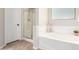 Bright bathroom with a soaking tub, shower, and stylish tile flooring at 2648 E Teakwood Pl, Chandler, AZ 85249