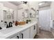 Bright bathroom featuring double sinks, white cabinetry, and neutral paint at 2648 E Teakwood Pl, Chandler, AZ 85249