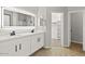 Modern bathroom with dual sinks, a large mirror, and a walk-in shower provides a serene spa experience at 2648 E Teakwood Pl, Chandler, AZ 85249