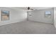 Large bedroom showcasing multiple windows, neutral carpet and paint, and ample space at 2648 E Teakwood Pl, Chandler, AZ 85249