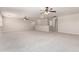 Spacious upstairs bonus room with neutral carpet, modern ceiling fans, and a view of hallway at 2648 E Teakwood Pl, Chandler, AZ 85249