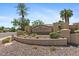 Entrance sign for Riggs Ranch Meadows community with desert landscaping and palm trees at 2648 E Teakwood Pl, Chandler, AZ 85249