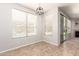 Sun-filled dining area with tile floors and views of the pool. The space is perfect for relaxation and enjoyment at 2648 E Teakwood Pl, Chandler, AZ 85249