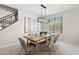 Bright dining room features a modern chandelier and a large window with natural light at 2648 E Teakwood Pl, Chandler, AZ 85249