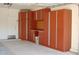 Garage features custom storage cabinets and a clean, well-maintained floor at 2648 E Teakwood Pl, Chandler, AZ 85249