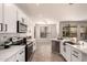 Updated kitchen with modern appliances, white cabinets, quartz counters, and a view of the outdoor pool at 2648 E Teakwood Pl, Chandler, AZ 85249