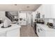 Bright, modern kitchen with white cabinets, stainless steel appliances, and an island at 2648 E Teakwood Pl, Chandler, AZ 85249