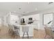 Bright, open kitchen featuring a large island with bar seating and modern stainless steel appliances at 2648 E Teakwood Pl, Chandler, AZ 85249