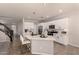 Open concept kitchen with an island, stainless steel appliances, and modern white cabinets, perfect for entertaining at 2648 E Teakwood Pl, Chandler, AZ 85249