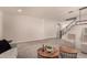 Spacious living room with staircase, contemporary lighting and plush carpeting at 2648 E Teakwood Pl, Chandler, AZ 85249