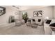 Open-concept living area featuring neutral decor, comfortable seating, and a staircase at 2648 E Teakwood Pl, Chandler, AZ 85249