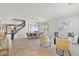 Spacious living room with tile and carpet floors, neutral walls, dining table and staircase at 2648 E Teakwood Pl, Chandler, AZ 85249